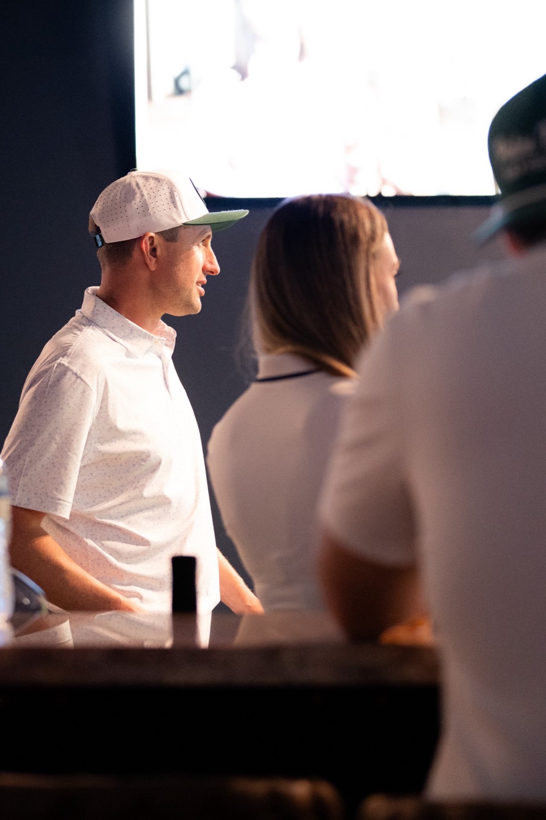 Members at the bar watching the final round on the big screen