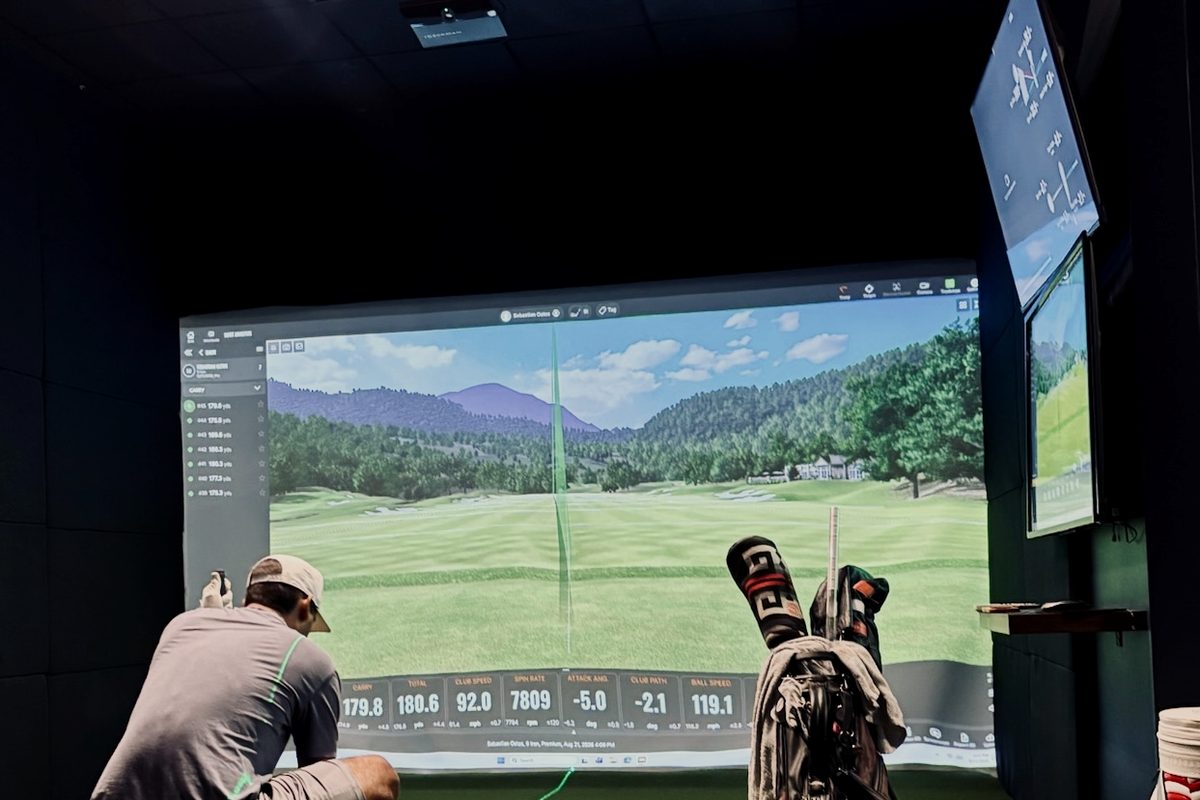 A member at a TrackMan bay early in the morning